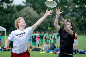 Two men jumping for the frisbee